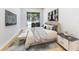 Main bedroom with plush bedding and access to the backyard at 4748 Hickory Oak Dr, Brooksville, FL 34601