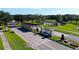Entrance to the community with a scenic pond and lush landscaping at 4748 Hickory Oak Dr, Brooksville, FL 34601