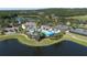 Aerial view of community pool, tennis courts, and clubhouse at 4748 Hickory Oak Dr, Brooksville, FL 34601