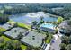 Aerial view of community amenities including tennis courts and pool at 4748 Hickory Oak Dr, Brooksville, FL 34601