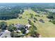 Aerial view of golf course community with clubhouse and homes at 4748 Hickory Oak Dr, Brooksville, FL 34601