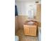 Bathroom vanity with granite counter and a mirrored medicine cabinet at 527 4Th Nw Ave, Largo, FL 33770