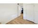 Bedroom with light wood flooring, a closet, and easy access to the kitchen at 527 4Th Nw Ave, Largo, FL 33770