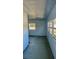 Enclosed sunroom featuring multiple windows for natural light at 527 4Th Nw Ave, Largo, FL 33770