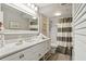 Well-lit bathroom with a white vanity, a spacious shower, and tasteful decorative accents at 5825 Puerta Del Sol S Blvd # 170, St Petersburg, FL 33715