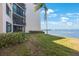 Waterfront condo featuring balconies, green space, and bay views, offering serene coastal living at 5825 Puerta Del Sol S Blvd # 170, St Petersburg, FL 33715