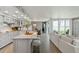 Bright and airy kitchen with an island, stainless appliances, and water views from the adjacent living area at 5825 Puerta Del Sol S Blvd # 170, St Petersburg, FL 33715