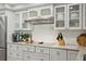 Close-up of kitchen features including granite countertops, tiled backsplash, and stainless steel appliances at 5825 Puerta Del Sol S Blvd # 170, St Petersburg, FL 33715