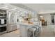 Well-equipped kitchen with stainless steel appliances, granite countertops, and a central island with barstools at 5825 Puerta Del Sol S Blvd # 170, St Petersburg, FL 33715