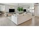 The living room features a plush sofa, large mirror wall, and wood flooring at 5825 Puerta Del Sol S Blvd # 170, St Petersburg, FL 33715