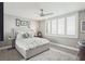 Comfortable bedroom featuring a ceiling fan, shuttered windows, and a well-coordinated design scheme at 5825 Puerta Del Sol S Blvd # 170, St Petersburg, FL 33715