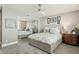 Serene bedroom boasts a mirrored closet, contemporary ceiling fan, and a neutral color palette at 5825 Puerta Del Sol S Blvd # 170, St Petersburg, FL 33715