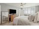 Inviting main bedroom featuring a bed with luxurious pillows, a large window, and wood floors at 5825 Puerta Del Sol S Blvd # 170, St Petersburg, FL 33715