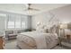 Calming main bedroom with shuttered windows, neutral colors, and soft lighting at 5825 Puerta Del Sol S Blvd # 170, St Petersburg, FL 33715