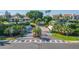 Scenic street view features lush landscaping, tropical foliage, and beautiful architecture with convenient pedestrian crosswalks at 5825 Puerta Del Sol S Blvd # 170, St Petersburg, FL 33715