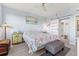 Main bedroom with a king-size bed and sliding barn door at 7979 Sailboat Key S Blvd # 202, South Pasadena, FL 33707