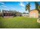 Expansive backyard featuring a screened pool, storage shed, and manicured lawn at 809 41St N Ave, St Petersburg, FL 33703