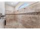 Spacious walk-in shower with multiple shower heads and tile surround at 13102 Done Groven Dr, Dover, FL 33527