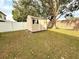 Tan storage shed in backyard at 2706 Mingo Dr, Land O Lakes, FL 34638