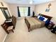 Comfortable bedroom with a king-size bed and ensuite bathroom at 2706 Mingo Dr, Land O Lakes, FL 34638