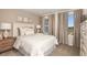 Bedroom with queen-size bed and neutral decor at 31454 Woodland Race Loop, Wesley Chapel, FL 33545