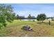 Spacious backyard with lake view and fire pit at 501 9Th Ne St, Ruskin, FL 33570