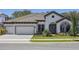 Charming single-story home with a three-car garage and well-manicured front yard at 12823 Daleridge Pl, Riverview, FL 33579