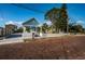 Light blue house on a brick street with mature trees at 509 W Cedar St, Tarpon Springs, FL 34689