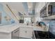 Modern kitchen with stainless steel appliances and marble countertops at 8246 Aquila St, Port Richey, FL 34668