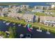 Aerial view of waterfront condos featuring private boat docks and canal access at 8246 Aquila St, Port Richey, FL 34668