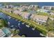 Aerial view of the condos showing the waterfront access, boat docks, and nearby tennis courts at 8246 Aquila St, Port Richey, FL 34668