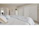 Main bedroom with ample closet space and plush bedding at 8246 Aquila St, Port Richey, FL 34668