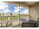 Screened balcony overlooking the community and partial water view at 8246 Aquila St, Port Richey, FL 34668