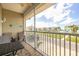 Private screened balcony with outdoor seating and water view at 8246 Aquila St, Port Richey, FL 34668