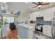 Open kitchen with stainless steel appliances, granite countertops, and a beautiful backsplash at 8246 Aquila St, Port Richey, FL 34668