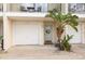 Townhouse with attached garage and welcoming front entrance at 8246 Aquila St, Port Richey, FL 34668