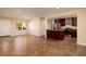 Modern kitchen with dark wood cabinets, stainless steel appliances, and granite countertops at 6614 10Th Avenue S Ter, St Petersburg, FL 33707