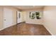 Bright entryway with tile flooring, open door to hallway, and window looking out to yard at 6614 10Th Avenue S Ter, St Petersburg, FL 33707