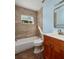 Updated bathroom with tile shower and wood vanity at 6614 10Th Avenue S Ter, St Petersburg, FL 33707