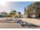 Bright yellow house with palm trees and a rock garden at 6614 10Th Avenue S Ter, St Petersburg, FL 33707