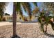 Yellow house with palm trees and a rock garden at 6614 10Th Avenue S Ter, St Petersburg, FL 33707