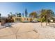 Yellow house with palm trees and a rock garden at 6614 10Th Avenue S Ter, St Petersburg, FL 33707