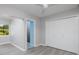 Bedroom with light walls, ceiling fan, and large closet at 6614 10Th Avenue S Ter, St Petersburg, FL 33707