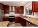 Modern kitchen with stainless steel appliances and granite countertops at 6614 10Th Avenue S Ter, St Petersburg, FL 33707
