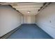 Attached garage with painted floor and access door at 6614 10Th Avenue S Ter, St Petersburg, FL 33707