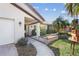 House exterior with walkway, landscaping, and garage at 1970 Illinois Ave Ne, St Petersburg, FL 33703