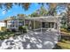 Mobile home with covered carport and landscaped yard at 217 Lake Tarpon Dr # 24, Palm Harbor, FL 34684