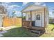 Charming backyard shed with wooden deck and front porch at 425 Treasure Rd, Venice, FL 34293