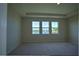 Bright, spacious bedroom with large windows offering a serene view at 1027 Ocean Spray Dr, Ruskin, FL 33570