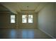 Bright dining room with large windows and tile flooring and contemporary chandelier at 1027 Ocean Spray Dr, Ruskin, FL 33570